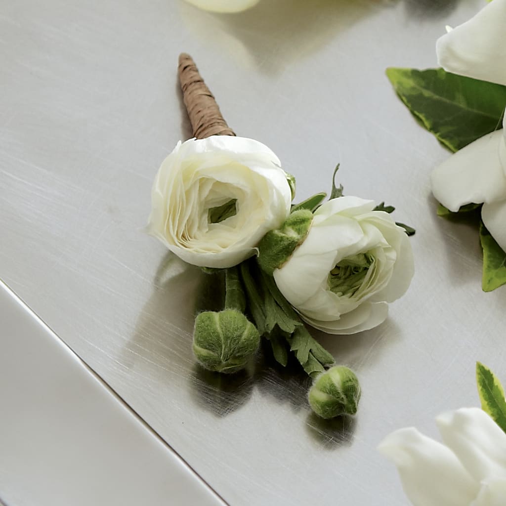 White Ranunculus Boutonniere – The Flower Garden, Nettleton MS